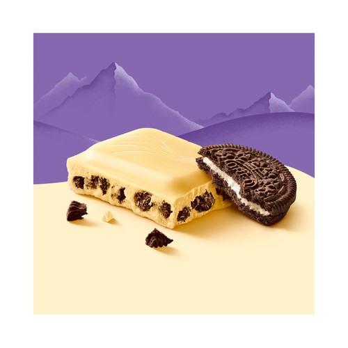 MILKA OREO BLANCO.Chocolate blanco con relleno sabor vainilla y trozos de galleta con cacao 100 g.