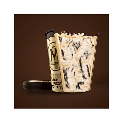 MAGNUM Tarrina de helado crema de nata con salsa de galleta al cacao, virutas de chocolate blanco y trozos de galleta 440 ml.