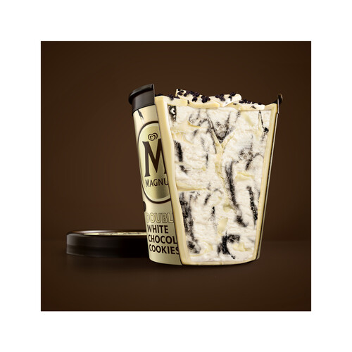 MAGNUM Tarrina de helado crema de nata con salsa de galleta al cacao, virutas de chocolate blanco y trozos de galleta MAGNUN Double 440 ml.